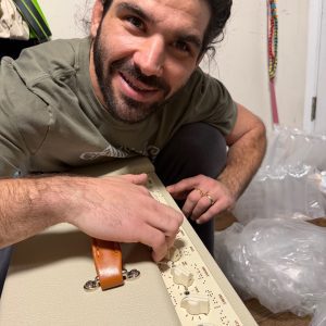 Anthony Ferraro holding a Victory Amp Braille edition